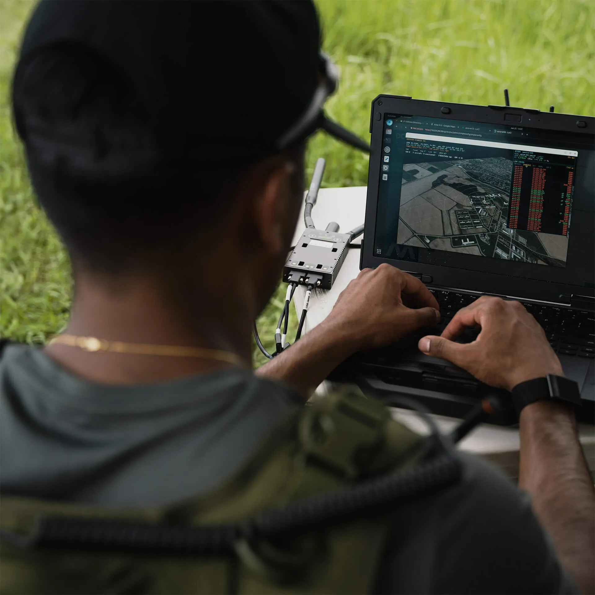 A Dominion Dynamics operator in the field running the platform on a rugged laptop.